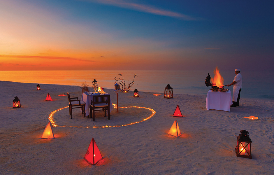private sunset beach dinner baros maldives