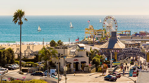 Sunny views of Santa Monica Pier and the ocean in California, USA. 
